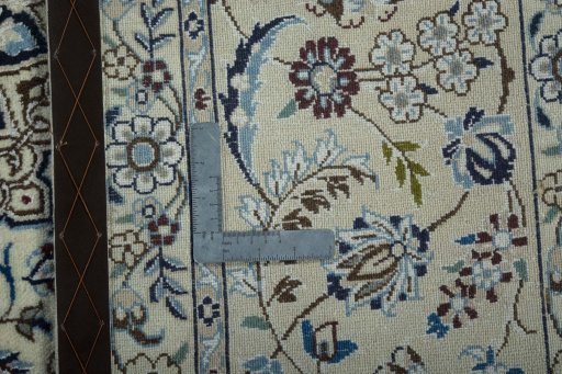 Backside of handmade 2000s Nain rug showing knot structure and weave density