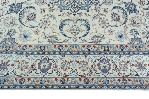 Corner detail of 2000s Nain rug showing border pattern and Wool pile