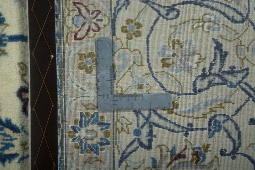 Backside of handmade 2000s Nain rug showing knot structure and weave density