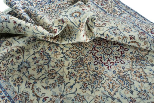 Surface texture of 2000s Nain rug with natural Wool and intricate pattern