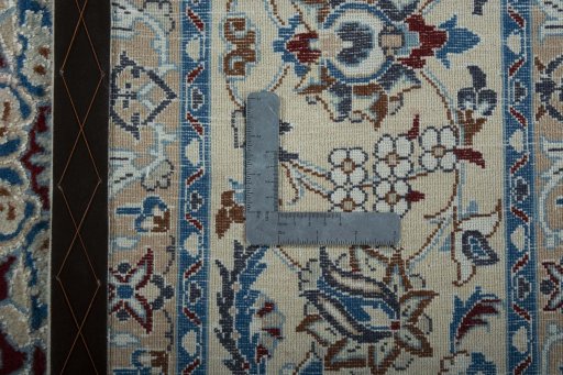 Backside of handmade 2000s Nain rug showing knot structure and weave density