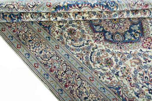 Corner detail of 2000s Nain rug showing border pattern and Wool pile