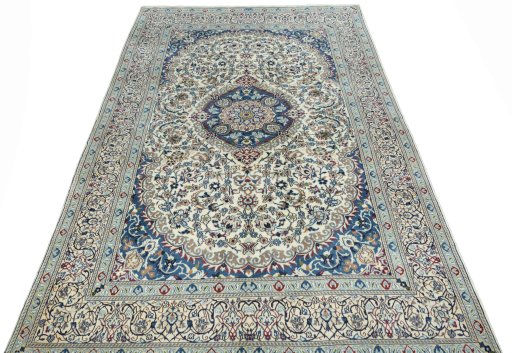 Surface texture of 2000s Nain rug with natural Wool and intricate pattern