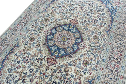 Backside of handmade 2000s Nain rug showing knot structure and weave density