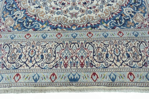 Close-up detail of 2000s Nain rug from Iran / Persia showing Wool weave