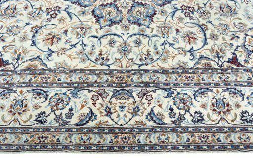 Corner detail of 2000s Nain rug showing border pattern and Wool pile