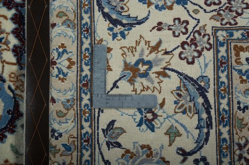 Backside of handmade 2000s Nain rug showing knot structure and weave density