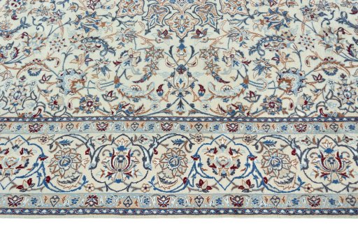 Corner detail of 2000s Nain rug showing border pattern and Wool pile