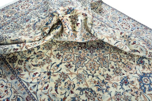 Surface texture of 2000s Nain rug with natural Wool and intricate pattern