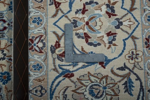 Backside of handmade 2000s Nain rug showing knot structure and weave density