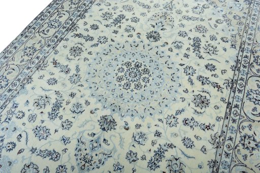 Backside of handmade New Nain rug showing knot structure and weave density