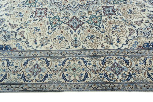 Corner detail of 2000s Nain rug showing border pattern and Wool pile