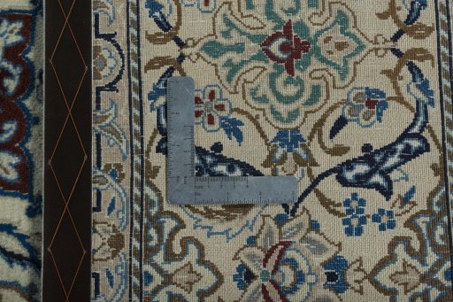 Backside of handmade 2000s Nain rug showing knot structure and weave density