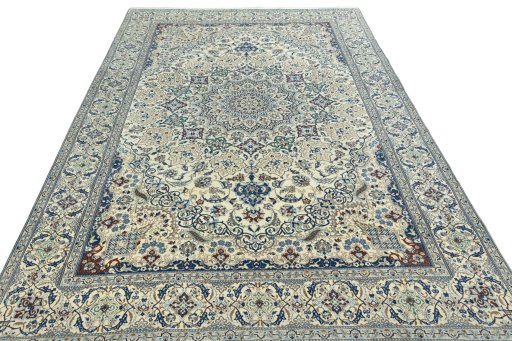 Surface texture of 2000s Nain rug with natural Wool and intricate pattern