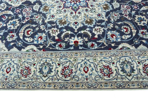Corner detail of 2000s Nain rug showing border pattern and Wool pile