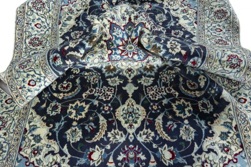 Surface texture of 2000s Nain rug with natural Wool and intricate pattern