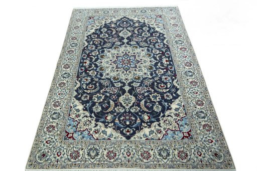 Surface texture of 2000s Nain rug with natural Wool and intricate pattern