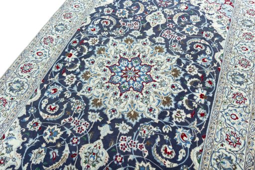 Backside of handmade 2000s Nain rug showing knot structure and weave density