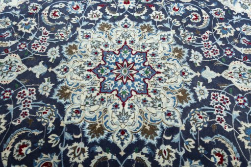 Central medallion detail of 2000s Nain rug from Iran / Persia