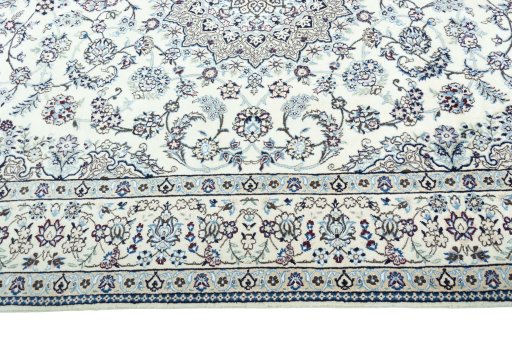Corner detail of 2000s Nain rug showing border pattern and Wool pile