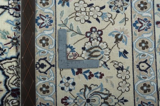Backside of handmade 2000s Nain rug showing knot structure and weave density