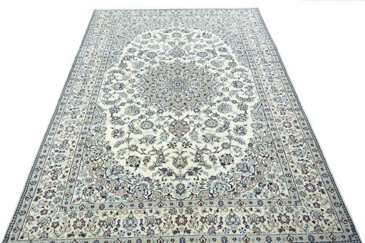 Surface texture of 2000s Nain rug with natural Wool and intricate pattern