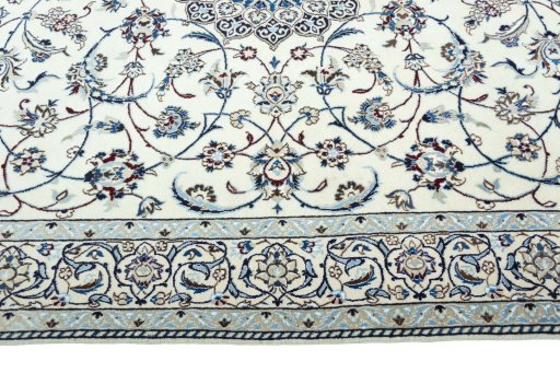Corner detail of 2000s Nain rug showing border pattern and Wool pile