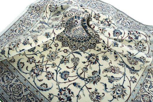 Surface texture of 2000s Nain rug with natural Wool and intricate pattern