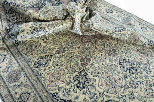 Surface texture of 1970s Nain rug with natural Wool and intricate pattern