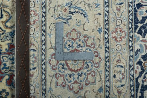 Backside of handmade 1970s Nain rug showing knot structure and weave density