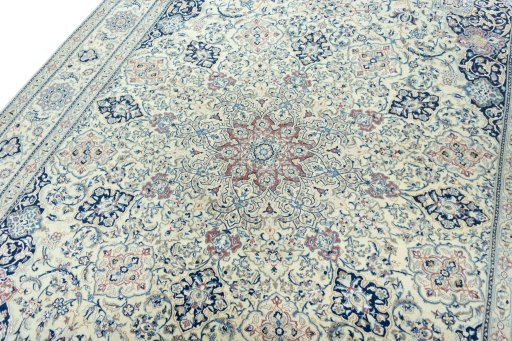 Backside of handmade 1970s Nain rug showing knot structure and weave density