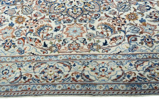 Corner detail of 2000s Nain rug showing border pattern and Wool pile