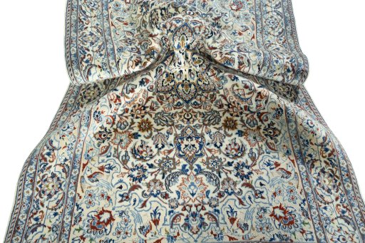 Surface texture of 2000s Nain rug with natural Wool and intricate pattern