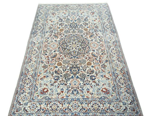 Surface texture of 2000s Nain rug with natural Wool and intricate pattern