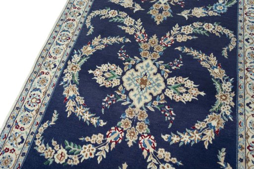 Backside of handmade 2000s Nain rug showing knot structure and weave density