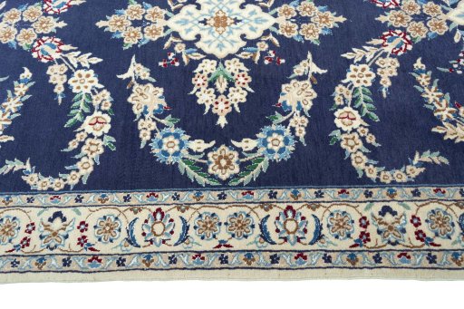 Close-up detail of 2000s Nain rug from Iran / Persia showing Wool weave