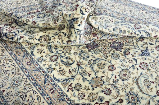 Surface texture of 2000s Nain rug with natural Wool and intricate pattern