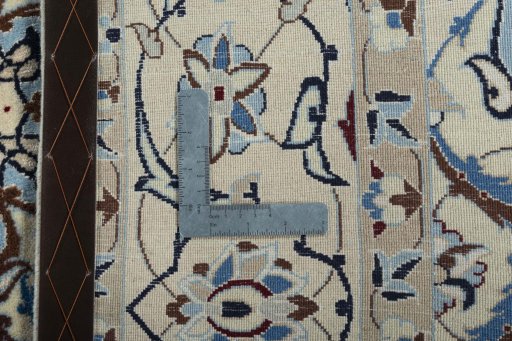 Backside of handmade New Nain rug showing knot structure and weave density