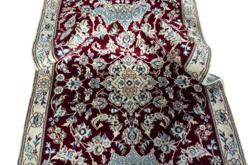 Surface texture of New Nain rug with natural Wool and intricate pattern
