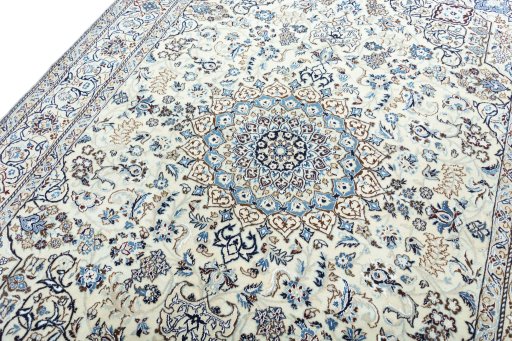 Backside of handmade New Nain rug showing knot structure and weave density