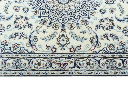 Corner detail of 2000s Nain rug showing border pattern and Wool pile