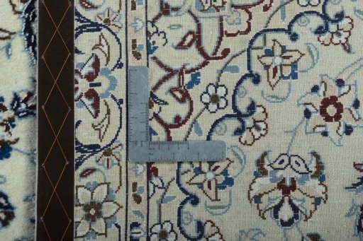 Backside of handmade 2000s Nain rug showing knot structure and weave density