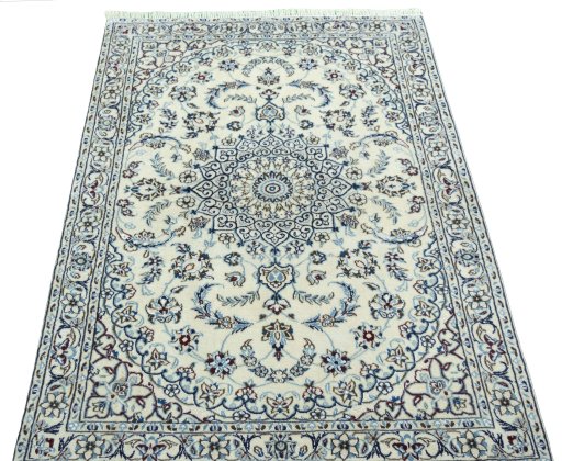 Surface texture of 2000s Nain rug with natural Wool and intricate pattern