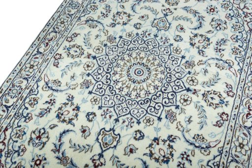 Backside of handmade 2000s Nain rug showing knot structure and weave density