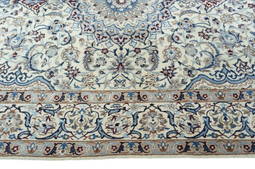 Corner detail of 2000s Nain rug showing border pattern and Wool pile