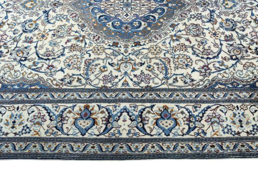Corner detail of 2000s Nain rug showing border pattern and Wool pile