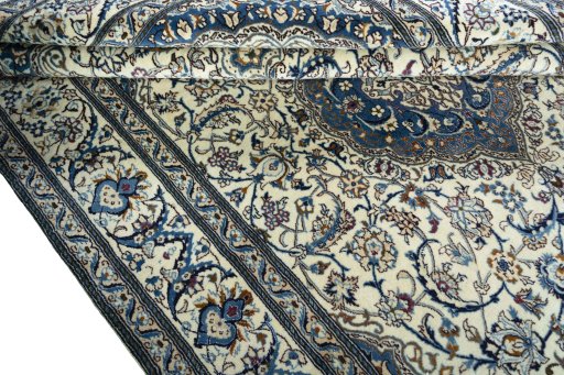 Close-up detail of 2000s Nain rug from Iran / Persia showing Wool weave