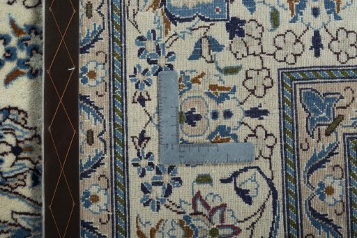 Backside of handmade 2000s Nain rug showing knot structure and weave density