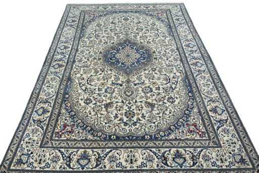 Surface texture of 2000s Nain rug with natural Wool and intricate pattern