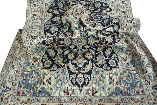 Surface texture of 2000s Nain rug with natural Wool and intricate pattern